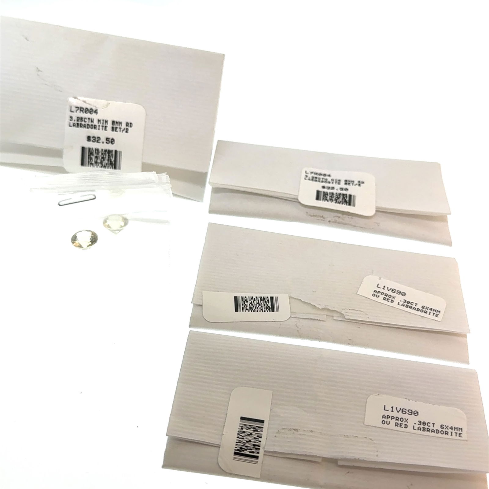 Labradorite Selection Red and Clear 7.1ct: This is a continuation of our pro jeweler's estate auction, but we've added some gems from another estate (JTV). The rest are from his personal collection, many faceted by himself. Gems were cataloged