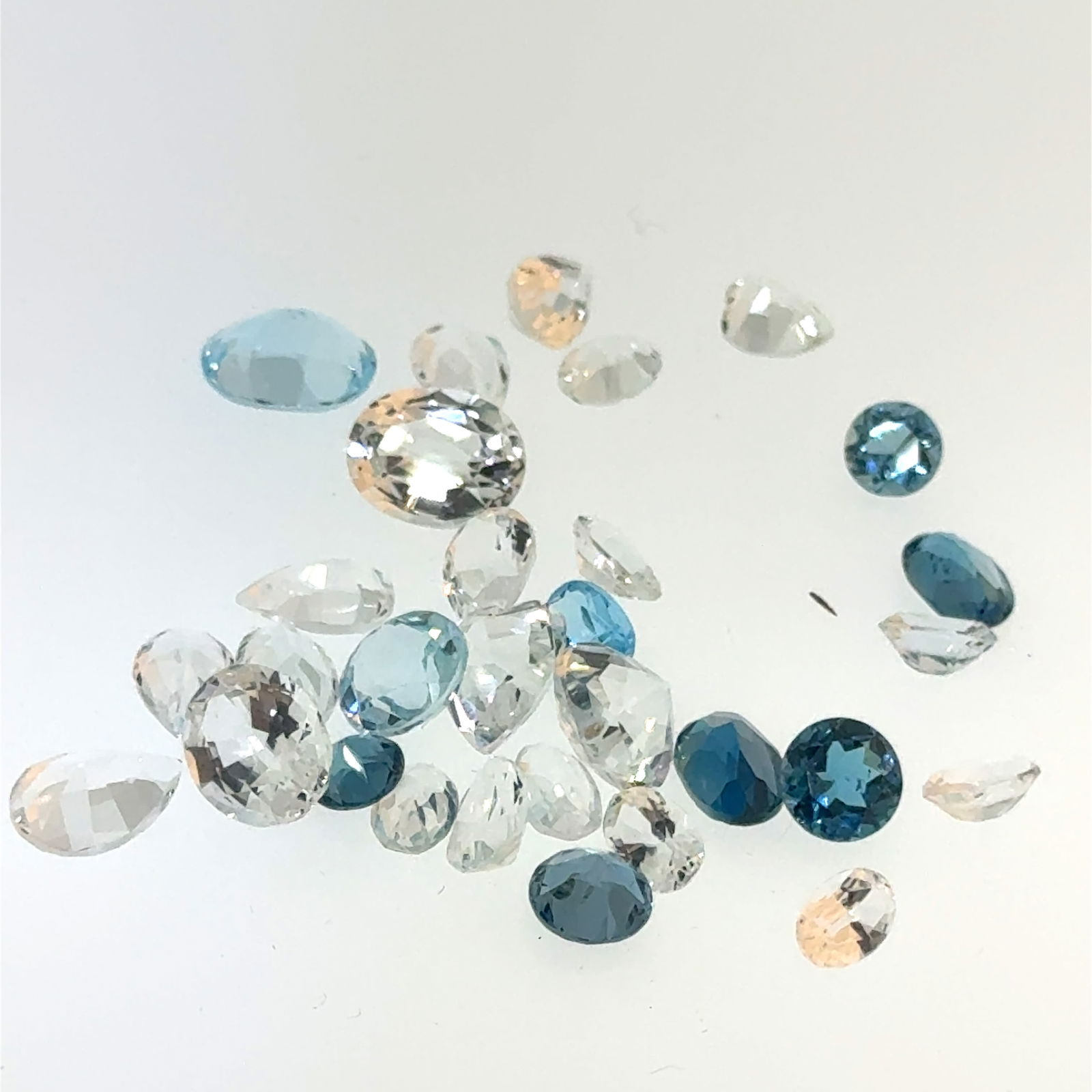 Mixed Topaz Gemstone Lot 30ct: This is a continuation of our pro jeweler's estate auction, but we've added some gems from another estate (JTV). The rest are from his personal collection, many faceted by himself. Gems were cataloged