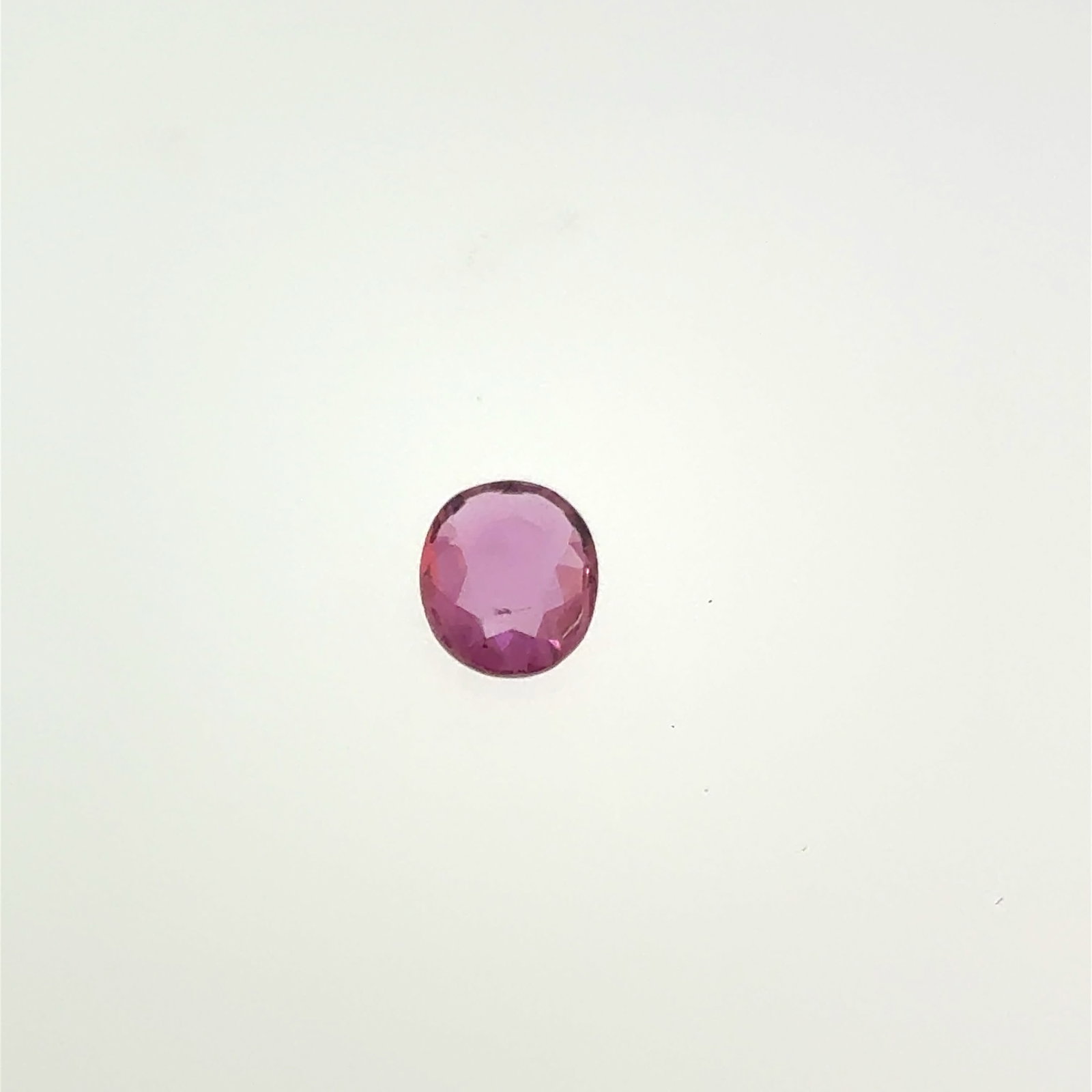 Oval Cut Pink Sapphire Gemstone .95ct 7x6mm (scratch underneath): This is a continuation of our pro jeweler's estate auction, but we've added some gems from another estate (JTV). The rest are from his personal collection, many faceted by himself. Gems were cataloged