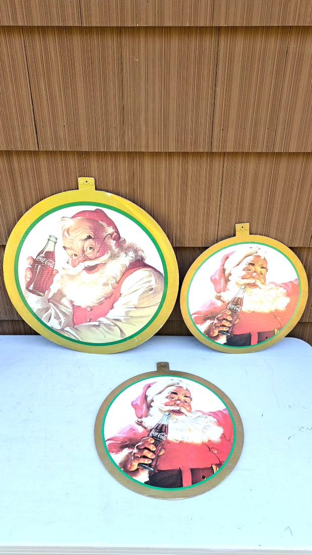 Vintage Coca-Cola Santa Claus Signs Cardboard Set of 3 - Red/White - Holiday Decor - Collectible: 25x25x3 3 READ: There are limited shipping options for this auction.This is an estate auction in Seattle WA featuring artwork, furniture, and general estate items.This auction offers local pick up in 