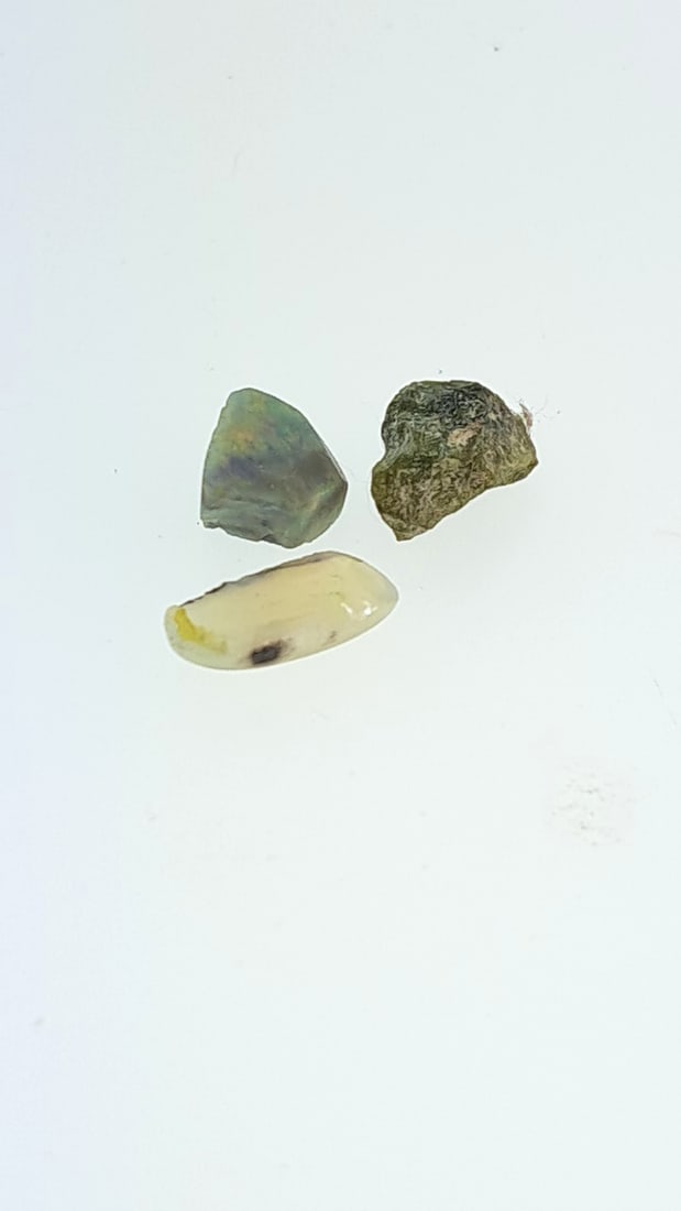 Rough Opal 1g: This is a continuation of our pro jeweler's estate auction. These are from his personal collection, many faceted by himself. Gems were cataloged with the assistance of GIA certified jewelers. Weights