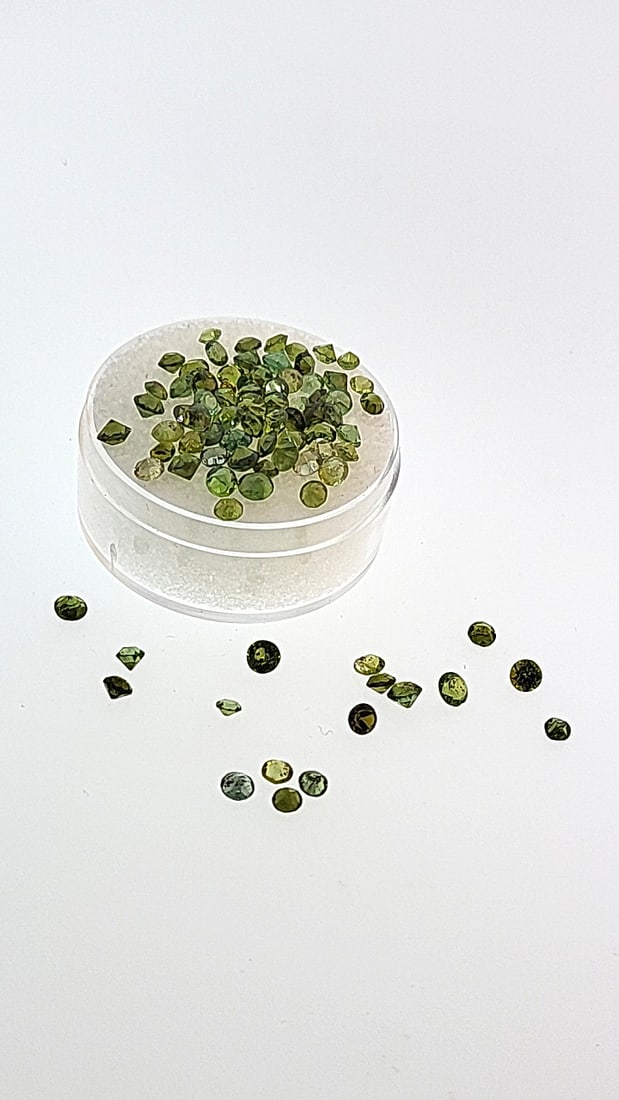 12.7ct Peridot Selection 2mm: This is a continuation of our pro jeweler's estate auction. These are from his personal collection, many faceted by himself. Gems were cataloged with the assistance of GIA certified jewelers. Weights