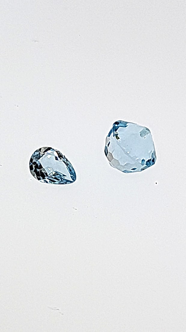 Blue Topaz Stud (one Hole Drilled) And Companion Stone 6.77ct: This is a continuation of our pro jeweler's estate auction. These are from his personal collection, many faceted by himself. Gems were cataloged with the assistance of GIA certified jewelers. Weights