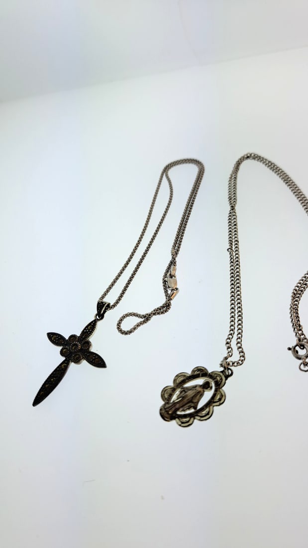 Sterling Cross And Saint Medallion And Sterling Chains 11.9g: This jewelry auction is part of an estate sale on 11/7 in Edmonds WA. Pick up will be at the sale, details here https://www.estatesales.net/WA/Edmonds/98026/4683240. Items tested using Kee gold tester