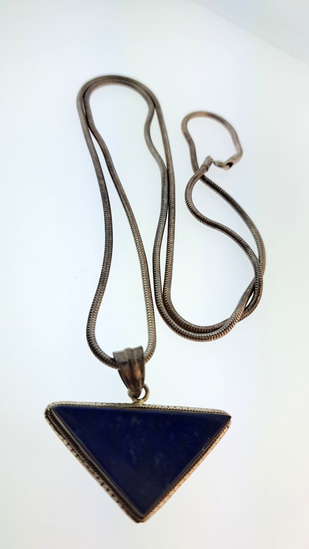 Vintage Sterling Silver Lapis Lazuli Triangle Pendant Necklace, Blue, 30": This jewelry auction is part of an estate sale on 11/7 in Edmonds WA. Pick up will be at the sale, details here https://www.estatesales.net/WA/Edmonds/98026/4683240. Items tested using Kee gold tester