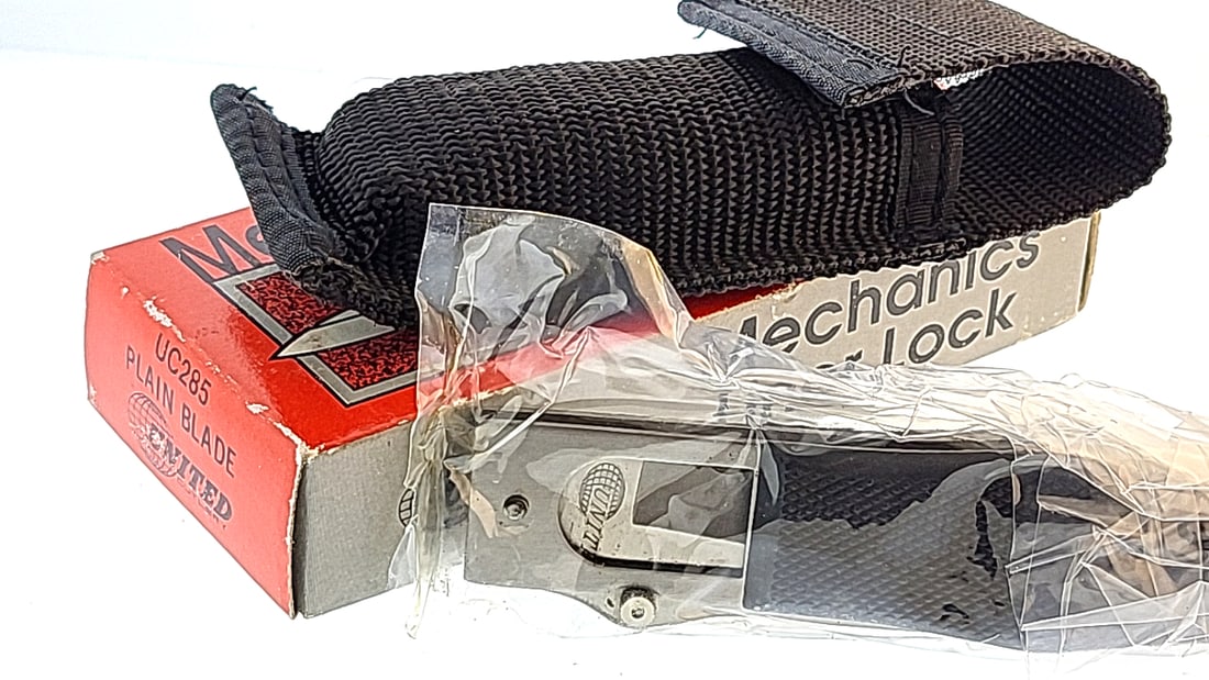 United Cutlery UC285 Mechanics Liner Lock Plain Blade Knife w/ Nylon Sheath: "great selection of pens, watches, knives, and other gift items. Pens are in as found condition, please inspect pictures closely. Watches are working unless stated otherwise, however they may need nee