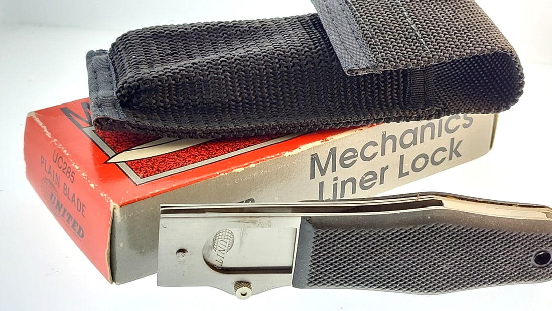 United UC285 Mechanics Liner Lock Knife Plain Blade with Sheath: "great selection of pens, watches, knives, and other gift items. Pens are in as found condition, please inspect pictures closely. Watches are working unless stated otherwise, however they may need nee
