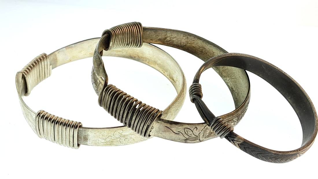 Tribal Metal Bangles Set with Intricate Engravings and Coil Wraps: Nice mix of estate goods. The family behind this estate had a high-end gift shop, so there's lots of brand new inventory including a large collection of King and Country, New ACME pens, quality watche