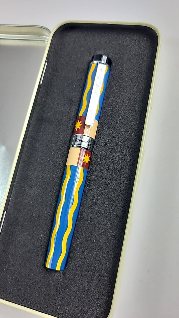 ACME Michael Graves Pen Colorful Blue Yellow Wave Design Metal Clip Signature Logo Case: Nice mix of estate goods. The family behind this estate had a high-end gift shop, so there's lots of brand new inventory including a large collection of King and Country, New ACME pens, quality watche