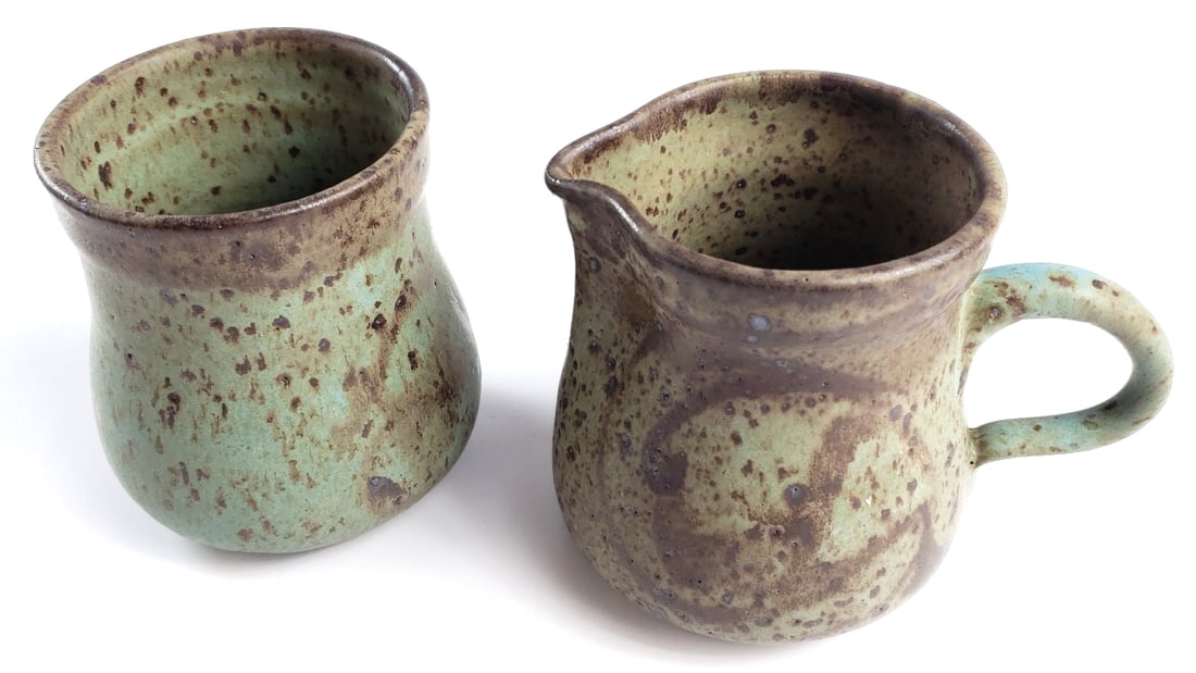 Vintage Ceramic Pitcher and Cup Set with Speckled Glaze Signed By Artist: Nice Height: 5 High Estimate: 150 Low Estimate: 30 Width: 5