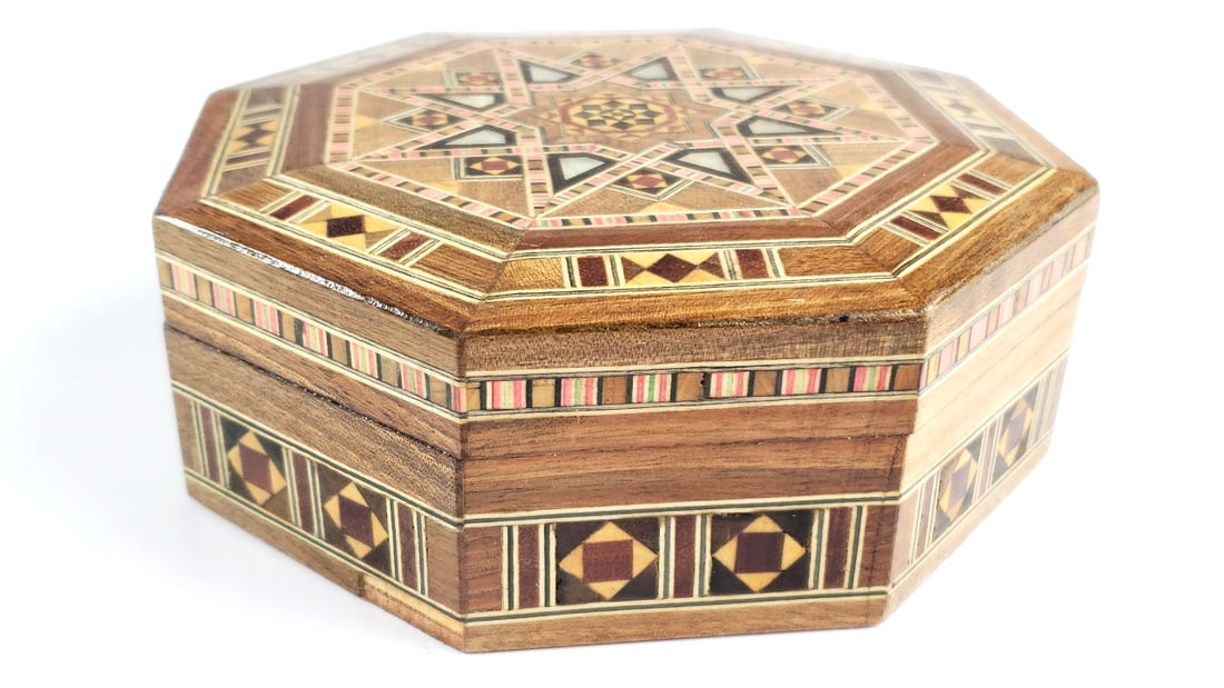 Handcrafted Inlaid Octagonal Wooden Box with Geometric Inlay Design: Good, small trim chip. Height: 6 Width: 2 High Estimate: 150 Low Estimate: 30