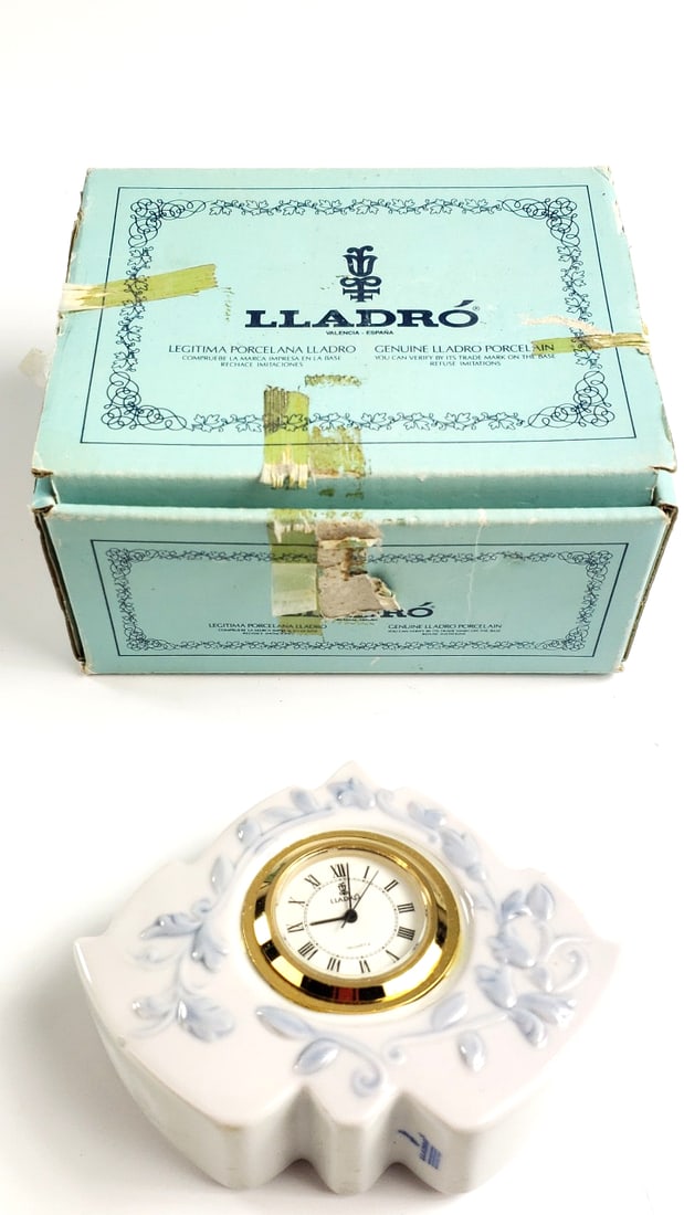 Lladro Porcelain Desk Clock with Original Box and Roman Numerals: Vintage Low Estimate: 50 Width: 2 Height: 3 High Estimate: 200