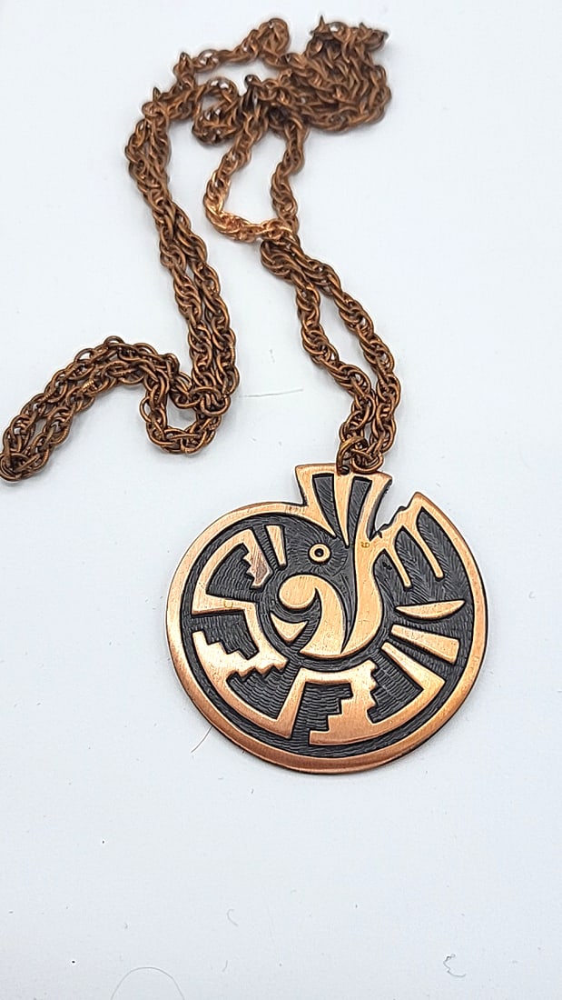 Copper Pendant Necklace With Abstract Design: Chain is darker in some places a d approx 29" 3x3x1 1 lb Height: 3 Width: 1 Low Estimate: 15.00 High Estimate: 120.00