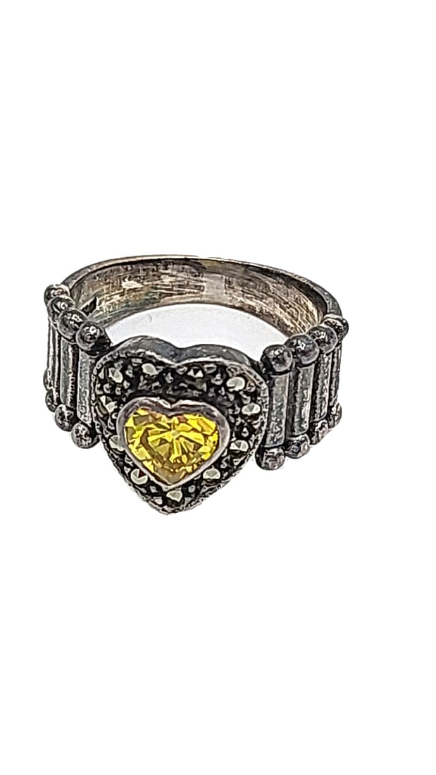 Sterling Silver Ring With Yellow Heart-shaped Gemstone 5.46g Size 5.5: Yellow stone does not register on tester. 2x2x2 1 lb Height: 2 Width: 2 Low Estimate: 20.00 High Estimate: 50.00
