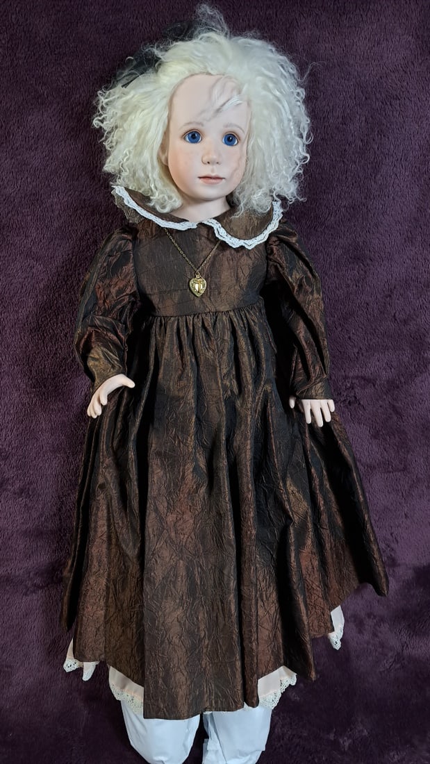 Julia Reuger Piper Handmade Artist Porcelain Doll: Please read descriptions and examine pictures carefully. Take into account shipping when bidding. 15x15x50 5lbs Height: 15 Width: 50 Low Estimate: 50.00 High Estimate: 350.00
