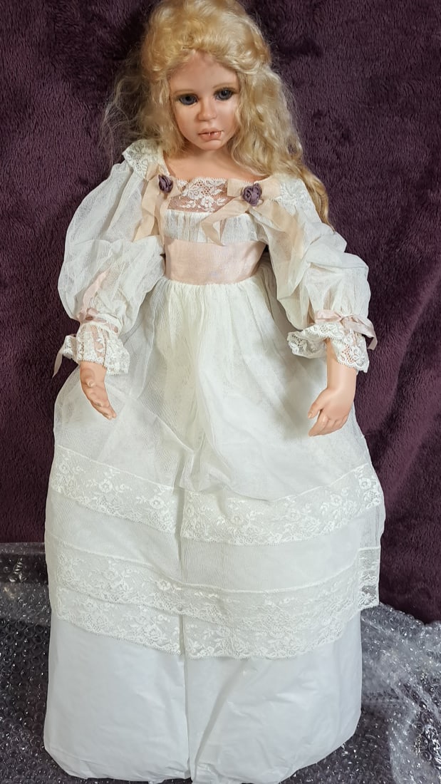 Karen Blandford Anderson Sisters Artists Made Porcelain Doll: Please read descriptions and examine pictures carefully. Take into account shipping when bidding. 42x16x10 15lbs Height: 16 Width: 10 Low Estimate: 20.00 High Estimate: 150.00