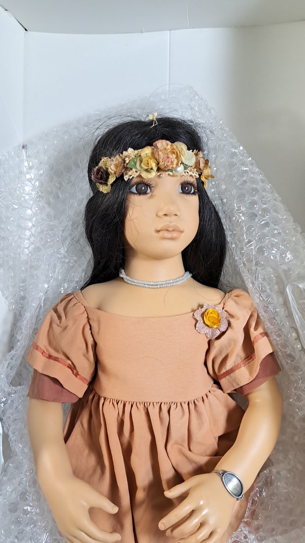 Annette Himstedt Morgana Doll With Flowers Coa: Please read descriptions and examine pictures carefully. Take into account shipping when bidding. 20x40x15 15lbs Height: 40 Width: 15 Low Estimate: 50.00 High Estimate: 400.00