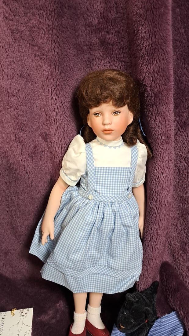 Susan Wakeen Dorothy Woz Porcelain Doll With Box And Toto And Scarf: Please read descriptions and examine pictures carefully. Take into account shipping when bidding. 30x10x9 15lbs Height: 10 Width: 9 Low Estimate: 50.00 High Estimate: 500.00