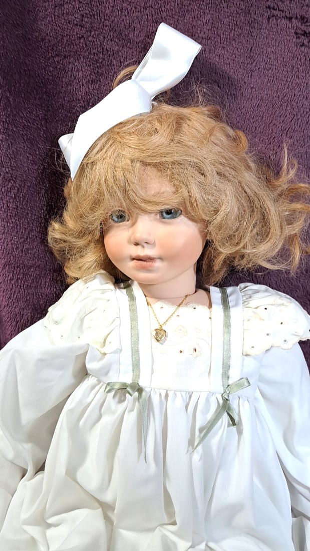 Gaby Rademann Einzelstleck Porcelain Doll With Stuffed Rabbit: Please read descriptions and examine pictures carefully. Take into account shipping when bidding. 50x24x12 15lbs Height: 24 Width: 12 Low Estimate: 50.00 High Estimate: 250.00