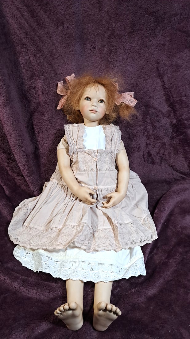 Annette Himstedt Tana Porcelain Doll With Box: Please read descriptions and examine pictures carefully. Take into account shipping when bidding. 36x20x15 15lbs Height: 20 Width: 15 Low Estimate: 50.00 High Estimate: 450.00