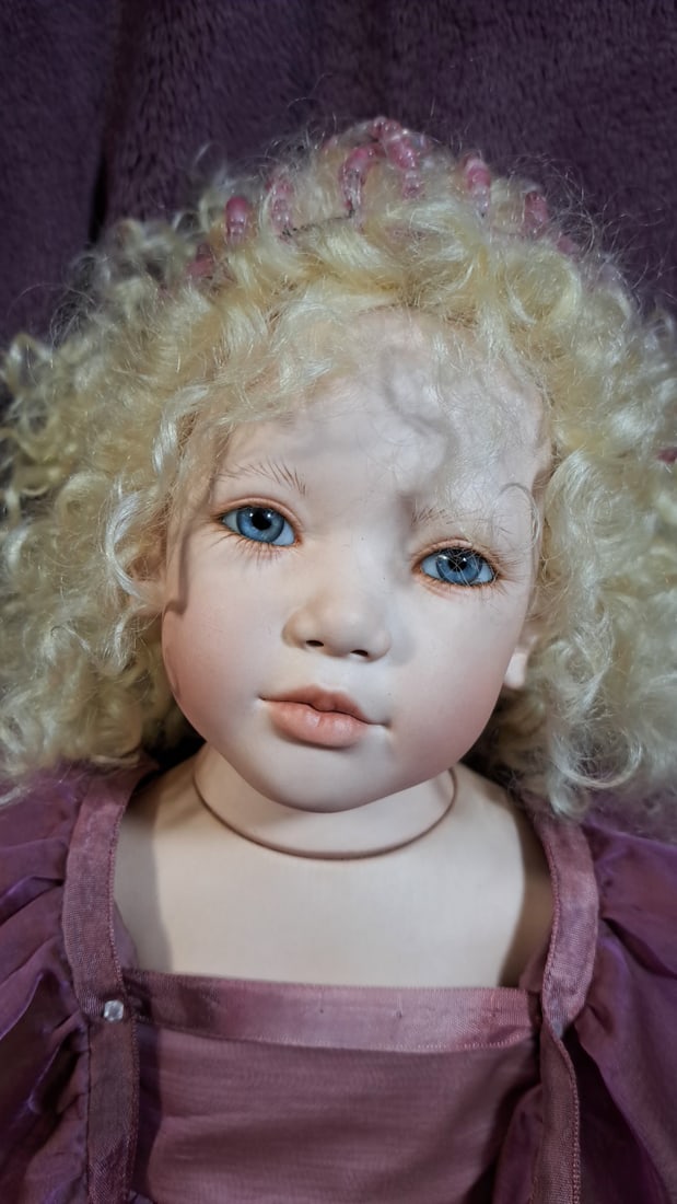 Annette Himstedt Fee Porcelain Doll With Box: Please read descriptions and examine pictures carefully. Take into account shipping when bidding. 36x20x15 15lbs Height: 20 Width: 15 Low Estimate: 50.00 High Estimate: 300.00