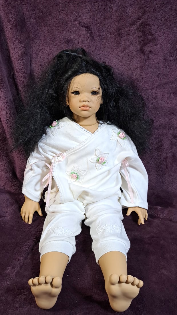 Annette Himstedt Kima Doll With Box: Please read descriptions and examine pictures carefully. Take into account shipping when bidding. Has alternate outfit not on box 36x20x15 15lbs Height: 20 Width: 15 Low Estimate: 50.00 High Estimate: