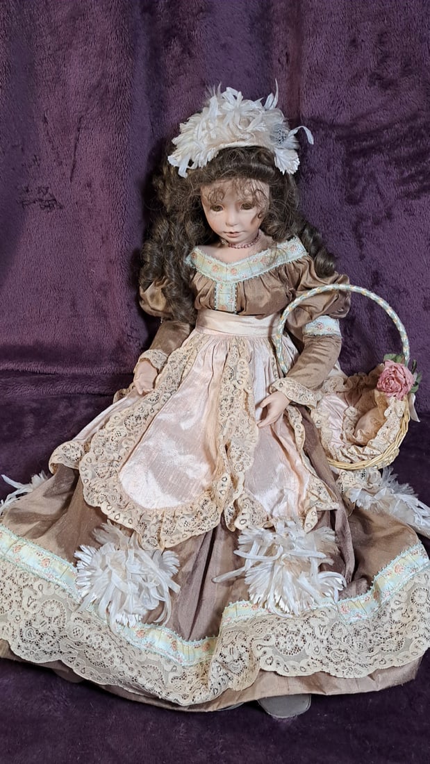 Gr Marie-claire Porcelain Doll With Basket: Please read descriptions and examine pictures carefully. Take into account shipping when bidding. 30x15x20 15lbs Height: 15 Width: 20 Low Estimate: 50.00 High Estimate: 60.00
