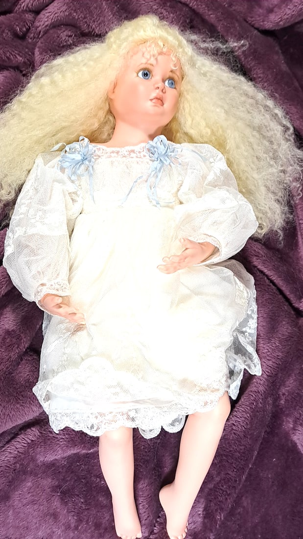 Karen Blandford Lara Porcelain Doll White Lace Dress Blue Ribbon Bows: Please read descriptions and examine pictures carefully. Take into account shipping when bidding. 30x10x10 3lbs Height: 10 Width: 10 Low Estimate: 10.00 High Estimate: 80.00