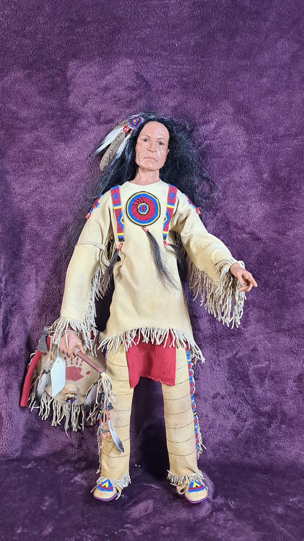 Sth Native American Doll: Please read descriptions and examine pictures carefully. Take into account shipping when bidding. Head broken off, hand damaged, hatchet rusted 25x10x15 15lbs Height: 10 Width: 15 Low Estimate: 50.00