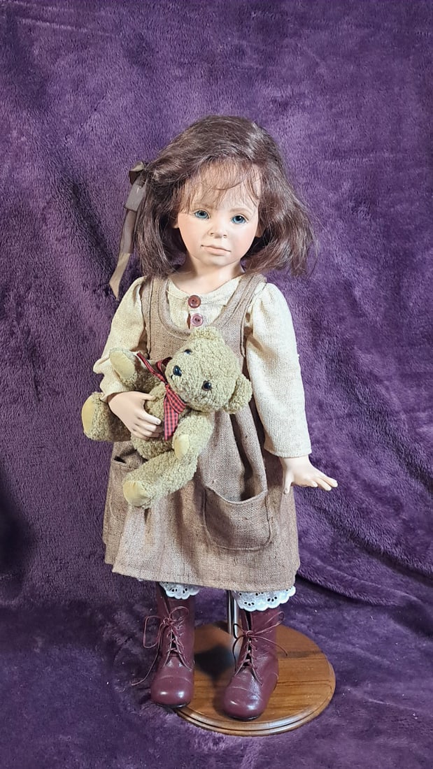 Porcelain Doll Roswitha With Bear: Please read descriptions and examine pictures carefully. Take into account shipping when bidding. 30x15x15 15lbs Height: 15 Width: 15 Low Estimate: 50.00 High Estimate: 80.00