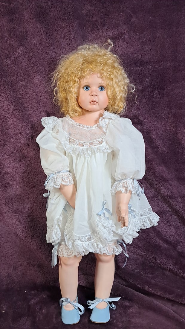 Sissel B. Skille 28 Artist Porcelain Blonde Curly Hair Blue Eyes White Lace Dress: Please read descriptions and examine pictures carefully. Take into account shipping when bidding. 30x15x15 15lbs Height: 15 Width: 15 Low Estimate: 50.00 High Estimate: 350.00