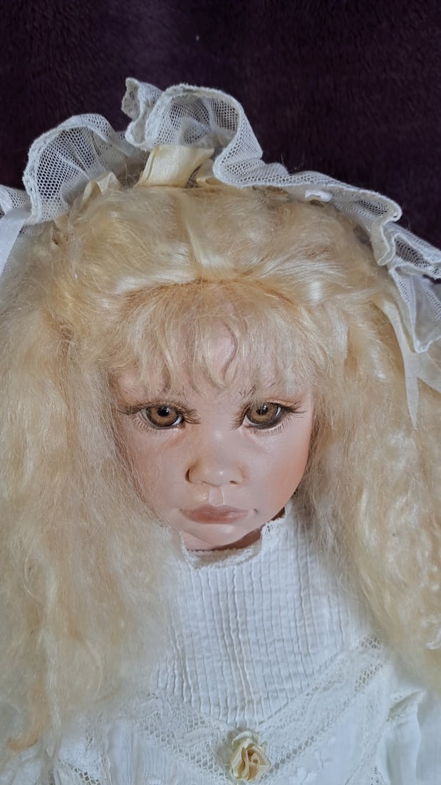 C Cumming Porcelain Doll with Blonde Hair, White Lace Dress, Bonnet and Wicker Chair - 4
