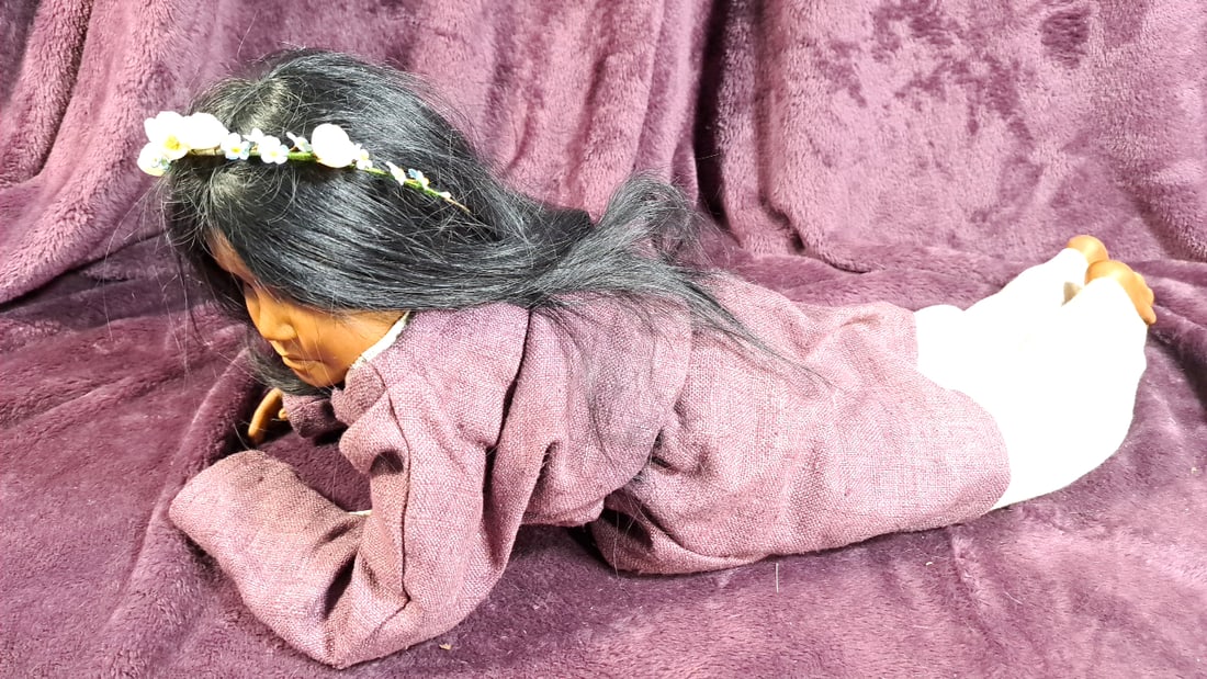 Signed 1992 Artist Doll with Black Hair, Floral Headband, Mauve Dress: 19 x 10 x 6 2.5 lb High Estimate: 50 Low Estimate: 10