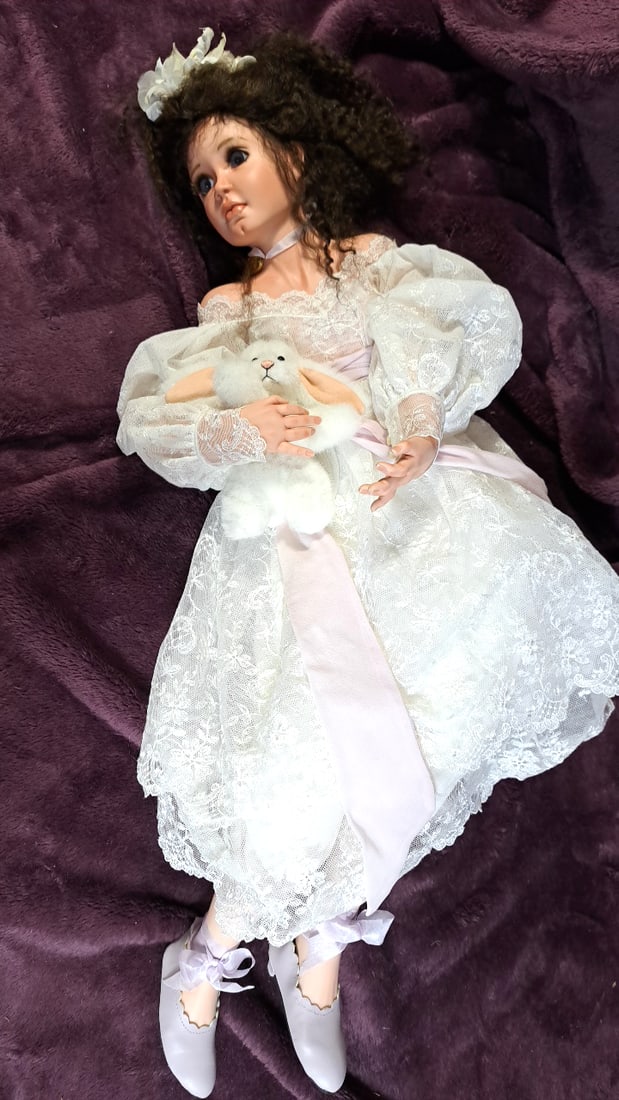 Blanford Porcelain Doll White Lace Dress Curly Dark Hair Blue Eyes Plush Bunny: 9 x 35 x 5 4 lb Low Estimate: 10 High Estimate: 40