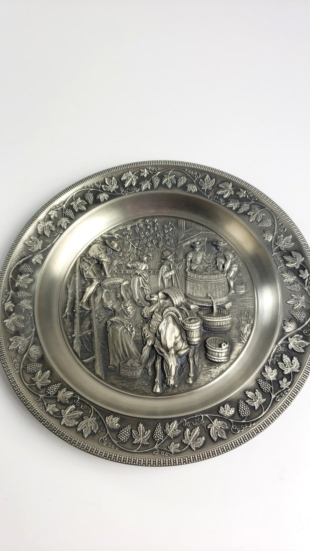 95% Zinn Pewter Relief Plate with Grape Harvest Wine Making Scene: 15 x 15 x 1 3 lb Low Estimate: 20.00 High Estimate: 45.00