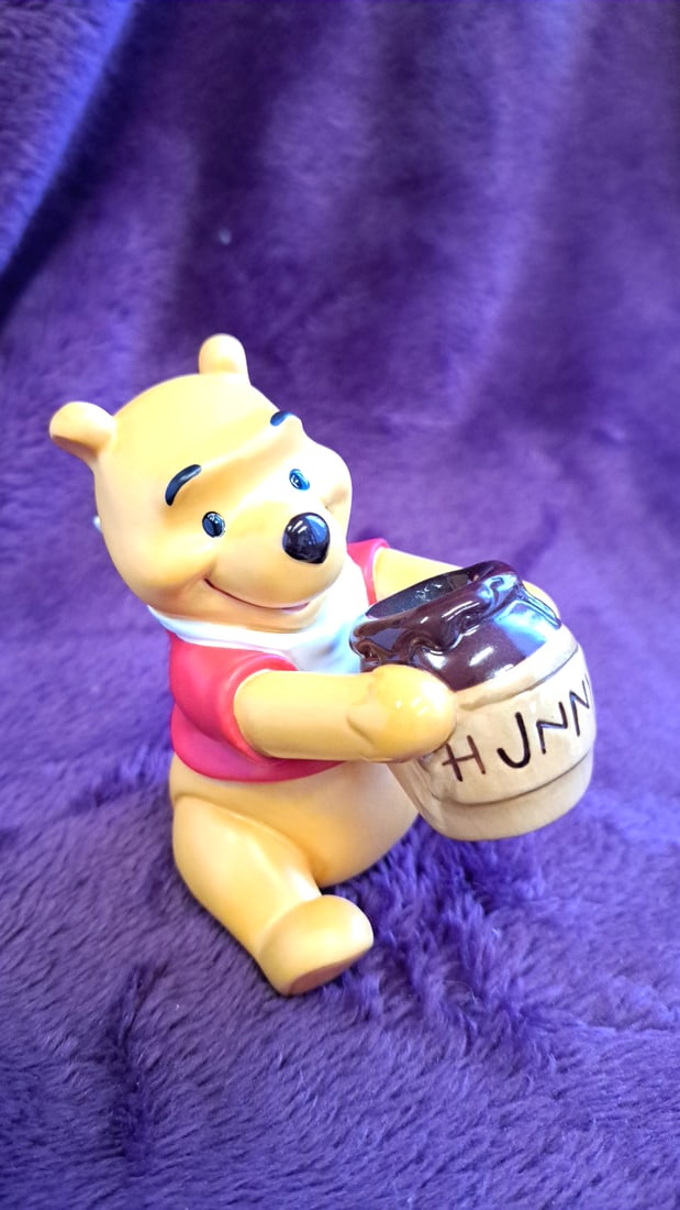 Disney Winnie The Pooh Ceramic Figurine Holding Hunny Pot With Box: 8 x 13 x 6 1. 5 lb Low Estimate: 5.00 High Estimate: 30.00