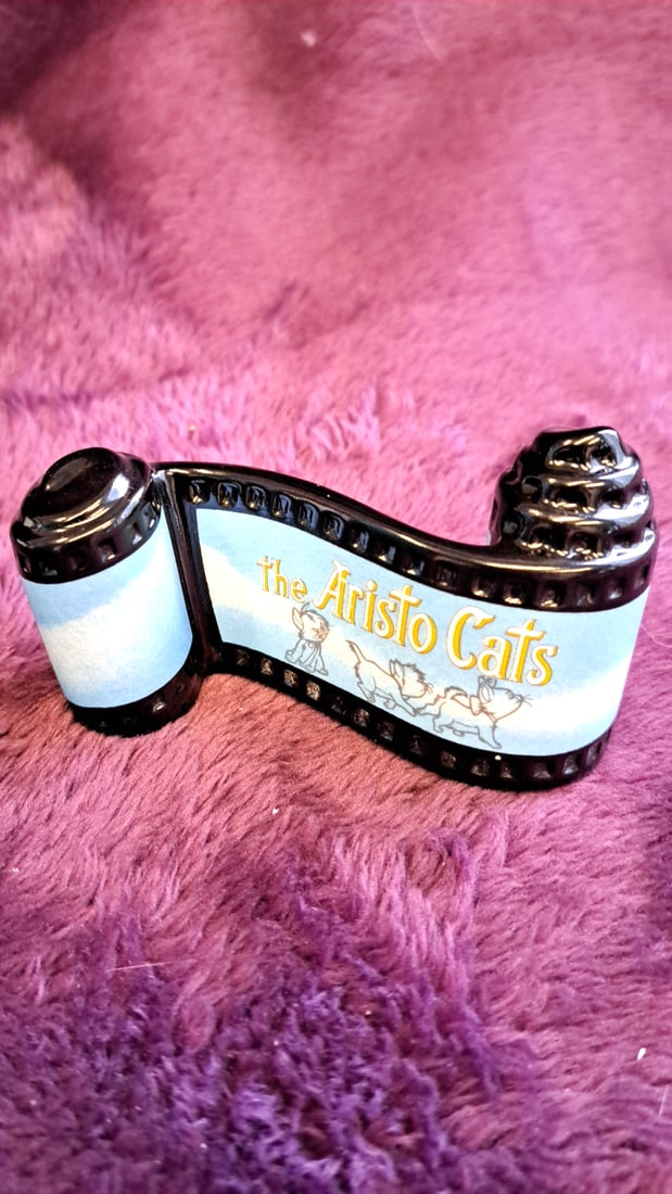 Disney Classics Walt Disney Collection The Aristocats Film Strip Scroll Figurine With Box: 2 x 6 x 2 0. 5 lb Low Estimate: 10.00 High Estimate: 35.00