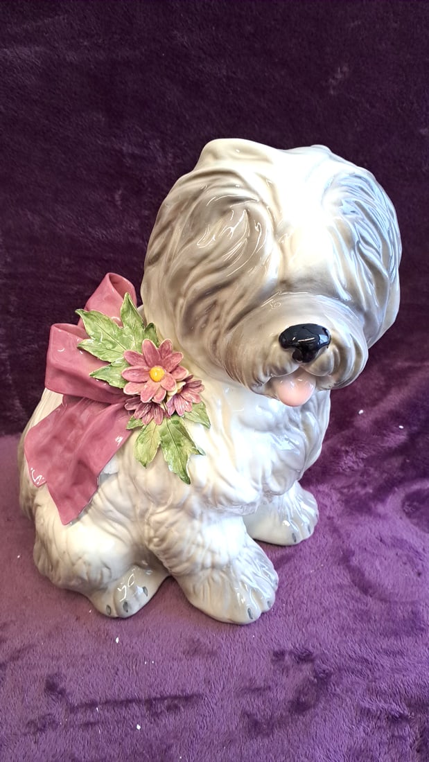 Betlar Inc Ceramic Shaggy Dog Figurine With Pink Bow And Flowers, 17 In: 10 x 16 x 8 6 lb Low Estimate: 25.00 High Estimate: 50.00