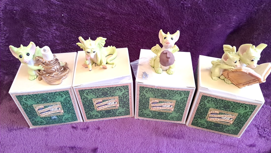 The Whimsical World Of Pocket Dragons Figurines Lot Of 4 With Boxes: 12 x 3 x 6 0. 3 lb Low Estimate: 50.00 High Estimate: 100.00