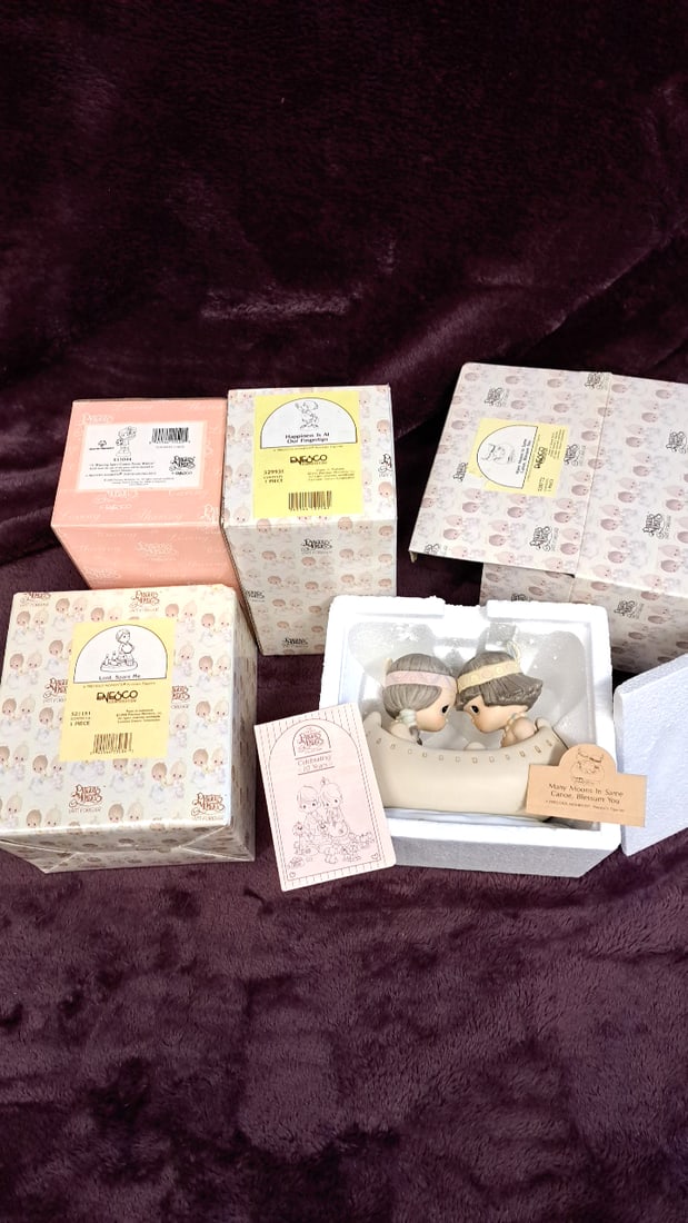 Precious Moments Enesco Porcelain Figurine Lot Lord Spare Me, Winning Spirit, Many Moons In Canoe: 13 x 12 x 6. 2 lb Low Estimate: 30.00 High Estimate: 100.00