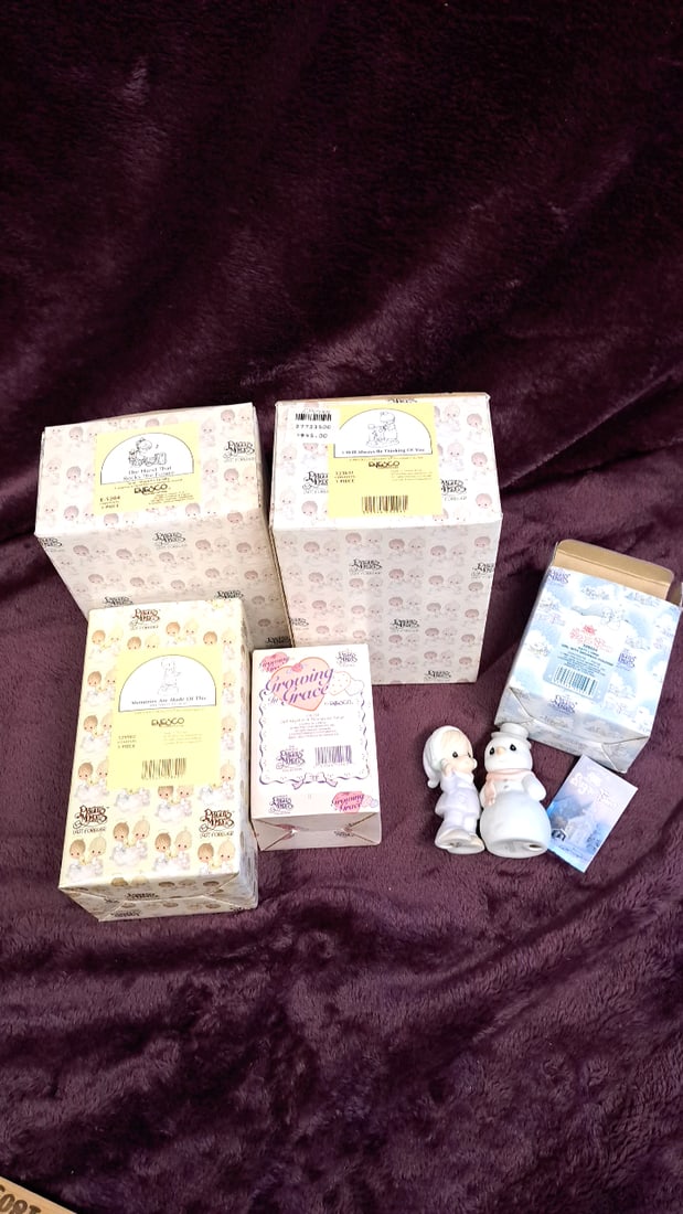 Precious Moments Enesco Porcelain Figurines: 14 x 12 x 6. 2 lb Low Estimate: 30.00 High Estimate: 150.00