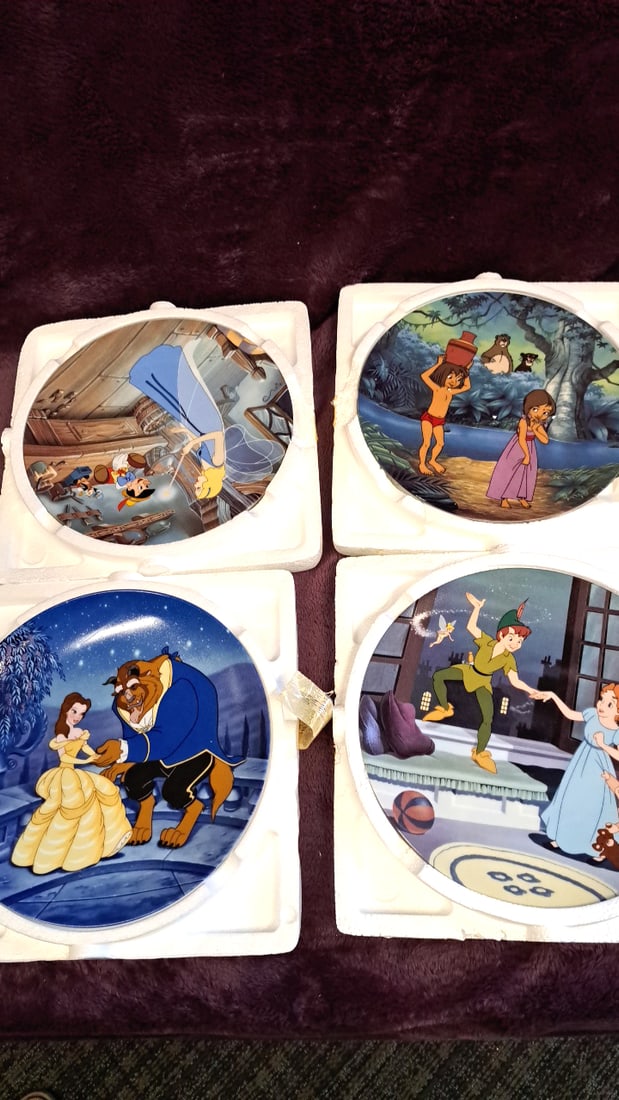 Disney Animated Classics Decorative Plates Set Of 4: Beauty And Beast, Peter Pan, Jungle Book, Pi...: 12x12x12 6lbs Low Estimate: 50.00 High Estimate: 150.00
