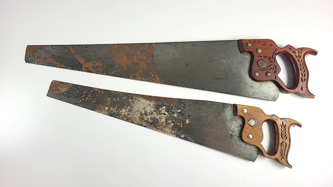 Pair Of Hand Saws With Carved Wooden Handles And Steel Blades Pace Maker As Is: 29x6x2 1lb Low Estimate: 20.00 High Estimate: 40.00