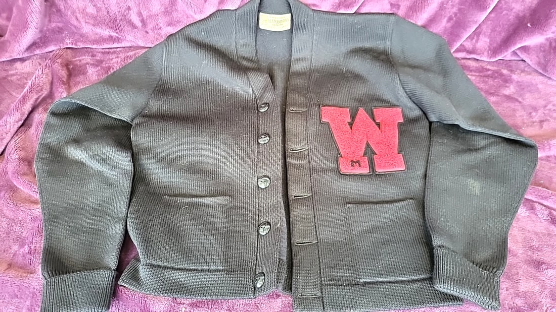Registered Letterman's Sweater Black Knit Varsity Cardigan Red W Chenille Patch: Good condition some light marks no holes 12x12x6 5 Low Estimate: 25.00 High Estimate: 85.00