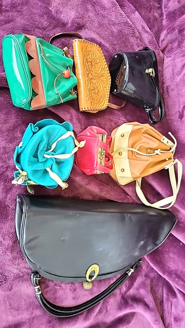 Lot of 7 Handbags, Deer Valley Tooled Leather, Patent Vinyl & Drawstring Purses: 15 x 17 x 6 3.5 lb Low Estimate: 25.00 High Estimate: 150.00
