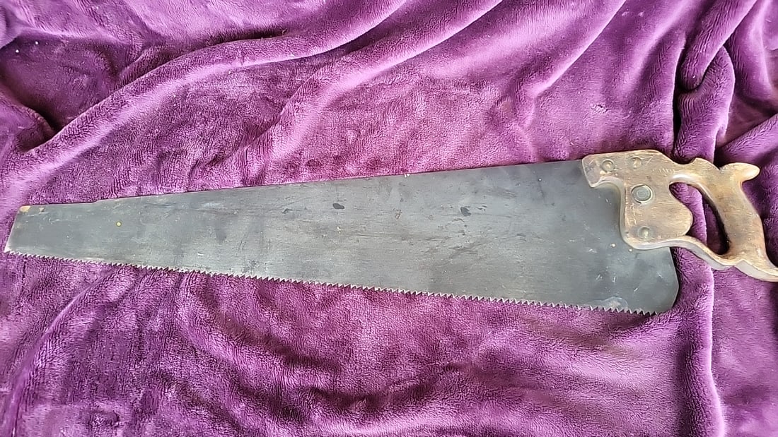Vintage Diston Hand Saw, 28 in Blade, Wooden Handle: 31 x 7 x 1 2.0 lb Low Estimate: 15.00 High Estimate: 50.00