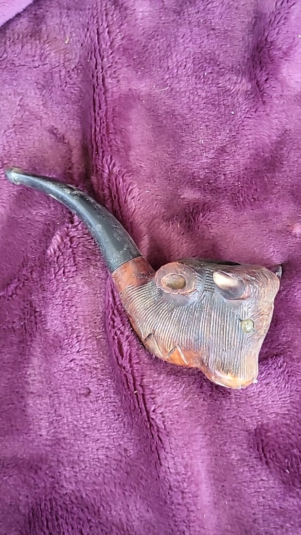 Imported Briar Carved Longhorn Bull Head Tobacco Pipe, Black Bent Stem: 5.3 x 2.0 x 3.0 0.3 lb Low Estimate: 20.00 High Estimate: 65.00