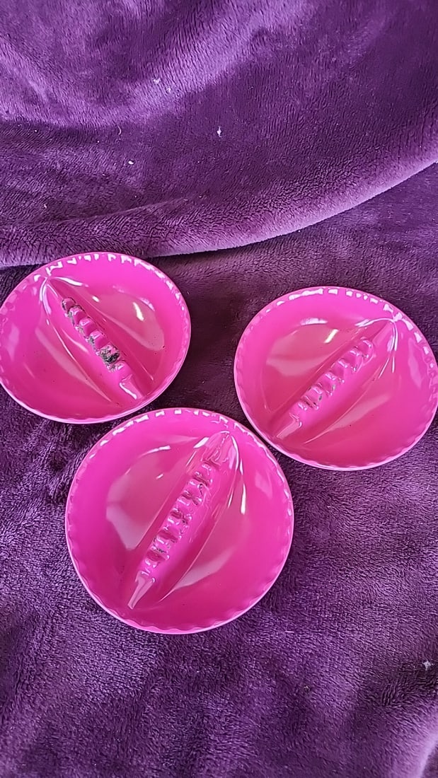 Lot of 3 A.H. Holt Pink Plastic Round Ashtrays Pat. 2362756: 4 x 1 x 4 1 lb Low Estimate: 10.00 High Estimate: 30.00