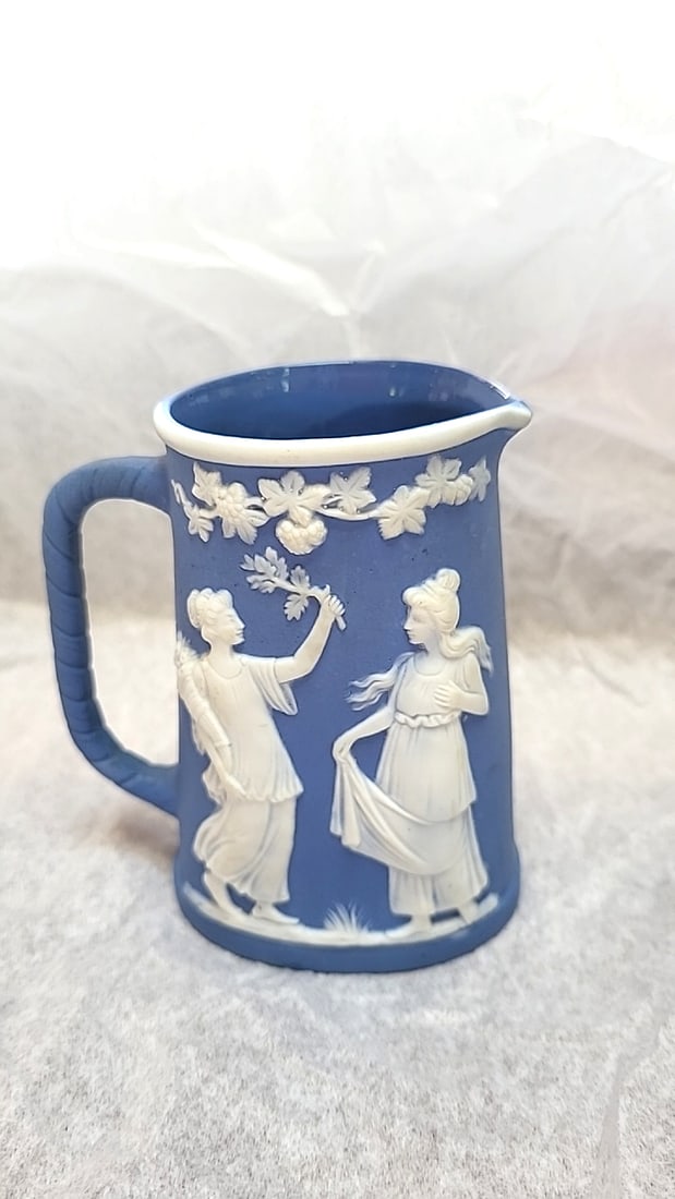 Blue Jasperware Creamer Pitcher with White Classical Relief Figures: 5.5 x 4 x 3.5 1.0 lb Low Estimate: 10.00 High Estimate: 35.00