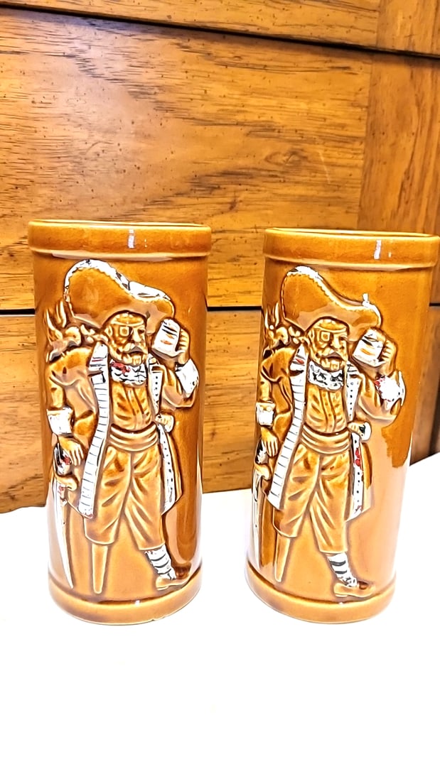 Pair of Brown Glazed Ceramic Pirate Relief Mugs. Buccaneers: 6.5 x 3 x 3 2 lb Low Estimate: 10.00 High Estimate: 35.00